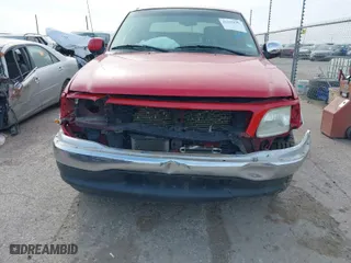 2002 Ford F-150 XLT with VIN 1FTRW07L82KE35460, listed as a IAAI auction lot 41243290 with 168,385 mi miles. Bid and sale history available at carsss.com. Image 6.