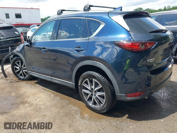 2018 Mazda CX-5 Grand Touring with VIN JM3KFBDM2J0373386, listed as a IAAI auction lot 42200795 with 70,111 mi miles and . Bid and sale history available at DreamBid. Image 3.