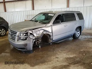 2018 Chevrolet Tahoe LS z VIN 1GNSKAKC5JR159133, wystawiony jako Copart lot #52867485 z przebiegiem Nie podano mil oraz Czysty tytuł • Clean title. Historia ofert i sprzedaży dostępna na DreamBid. Obrazek 1.