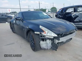 2015 Nissan 370Z z VIN JN1AZ4EH2FM442556, wystawiony jako IAAI lot #41956287 z przebiegiem 128 769 mil mil oraz . Historia ofert i sprzedaży dostępna na DreamBid. Obrazek 6.