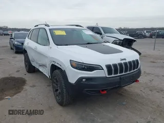 2019 Jeep Cherokee Trailhawk with VIN 1C4PJMBN6KD124023, listed as a IAAI auction lot 41432217 with 76,934 mi miles and . Bid and sale history available at DreamBid. Image 1.