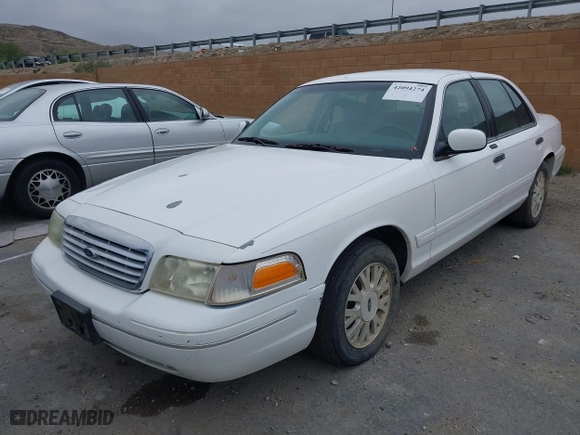 2003 Ford Crown Victoria LX with VIN 2FAFP74WX3X154904, listed as a IAAI auction lot 42094274 with 123,579 mi miles. Bid and sale history available at carsss.com. Image 2.