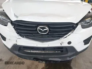 2016 Mazda CX-5 Grand Touring with VIN JM3KE2DYXG0675619, listed as a IAAI auction lot 42137144 with 106,262 mi miles and . Bid and sale history available at DreamBid. Image 6.