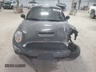2012 MINI Coupe S z VIN WMWSX3C51CT408195, wystawiony jako Copart lot #77008744 z przebiegiem Nie podano mil oraz Szkody całkowita. Historia ofert i sprzedaży dostępna na DreamBid. Obrazek 5.