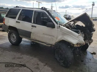 1996 Jeep Grand Cherokee Laredo with VIN 1J4GZ58S9TC277492, listed as a Copart auction lot 66732404 with Not provided miles and Salvage title. Bid and sale history available at DreamBid. Image 4.