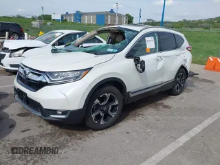 2018 Honda CR-V Touring with VIN 5J6RW2H99JL020598, listed as a IAAI auction lot 42104765 with 30,431 mi miles and . Bid and sale history available at carsss.com. Image 2.