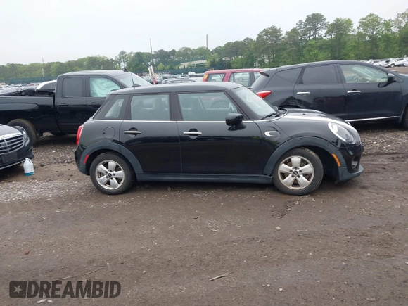 2020 MINI Hardtop 4 Door Cooper with VIN WMWXU7C04L2L58635, listed as a IAAI auction lot 42383785 with 27,160 mi miles and . Bid and sale history available at DreamBid. Image 13.