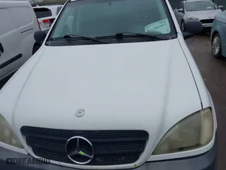 1999 Mercedes-Benz M-Class with VIN 4JGAB54E3XA141663, listed as a IAAI auction lot 41886982 with 196,503 mi miles. Bid and sale history available at carsss.com. Image 10.