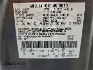 2012 Ford Escape XLT z VIN 1FMCU9DG8CKA93402, wystawiony jako Copart lot #62266845 z przebiegiem 196 779 mil mil oraz Szkoda całkowita • Salvage title. Historia ofert i sprzedaży dostępna na DreamBid. Obrazek 13.