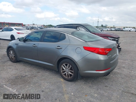 2013 Kia Optima LX z VIN 5XXGM4A74DG147688, wystawiony jako IAAI lot #42127503 z przebiegiem 148 705 mil mil oraz . Historia ofert i sprzedaży dostępna na DreamBid. Obrazek 3.