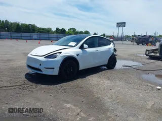 2023 Tesla Model Y Long Range z VIN 7SAYGDEE9PF753051, wystawiony jako IAAI lot #39615839 z przebiegiem Nie podano mil oraz . Historia ofert i sprzedaży dostępna na DreamBid. Obrazek 18.