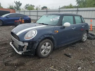 2015 MINI Hardtop 4 Door with VIN WMWXS5C59FT828503, listed as a Copart auction lot 58138565 with 129,264 mi miles and Salvage title. Bid and sale history available at DreamBid. Image 1.