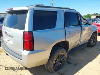 2020 Chevrolet Tahoe LT with VIN 1GNSKBKC5LR121085, listed as a IAAI auction lot 42341677 with 123,579 mi miles and . Bid and sale history available at DreamBid. Image 4.