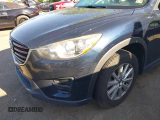 2016 Mazda CX-5 Sport with VIN JM3KE2BY3G0657904, listed as a IAAI auction lot 42127897 with 153,855 mi miles. Bid and sale history available at carsss.com. Image 6.