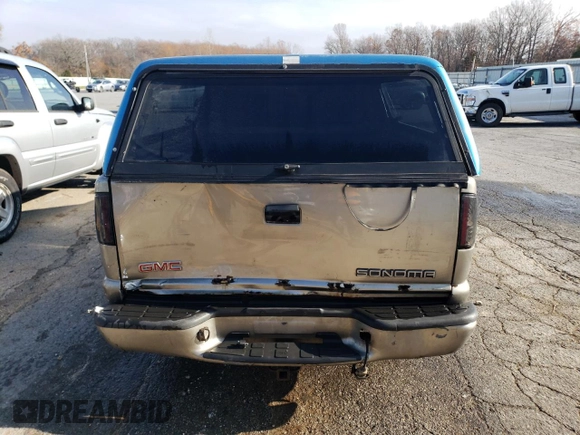 2000 GMC Sonoma SLS z VIN 1GTCS19W2Y8161077, wystawiony jako Copart lot #82616024 z przebiegiem 212 356 mil mil oraz Szkody całkowita. Historia ofert i sprzedaży dostępna na DreamBid. Obrazek 6.