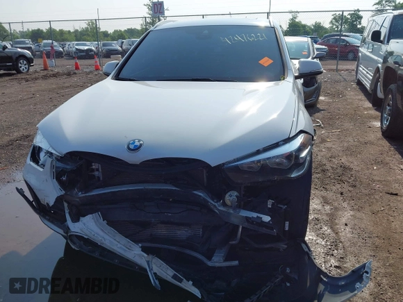 2021 BMW X1 xDrive28i with VIN WBXJG9C02M3M42379, listed as a IAAI auction lot 42476221 with 60,412 mi miles and . Bid and sale history available at DreamBid. Image 13.