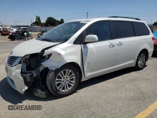 2015 Toyota Sienna XLE with VIN 5TDYK3DC1FS690219, listed as a Copart auction lot 60926525 with 97,879 mi miles and Salvage title. Bid and sale history available at DreamBid. Image 1.