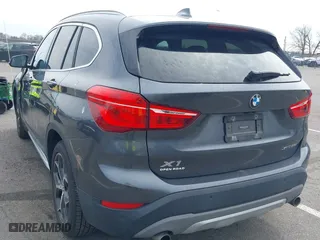 2019 BMW X1 xDrive28i with VIN WBXHT3C51K5L90571, listed as a IAAI auction lot 41909209 with 35,902 mi miles. Bid and sale history available at carsss.com. Image 3.