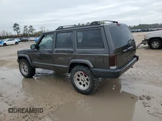 1999 Jeep Cherokee Sport with VIN 1J4FT68S2XL656679, listed as a Copart auction lot 88145875 with 254,038 mi miles and Salvage title. Bid and sale history available at DreamBid. Image 2.