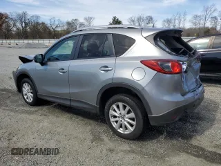 2014 Mazda CX-5 Touring with VIN JM3KE4CY1E0365787, listed as a Copart auction lot 49103355 with 144,031 mi miles and Salvage Title. Bid and sale history available at carsss.com. Image 2.
