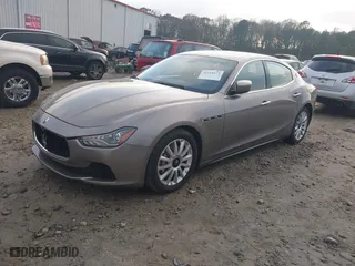 2014 Maserati Ghibli with VIN ZAM57XSA9E1082923, listed as a IAAI auction lot 41110273 with 91,551 mi miles. Bid and sale history available at carsss.com. Image 2.