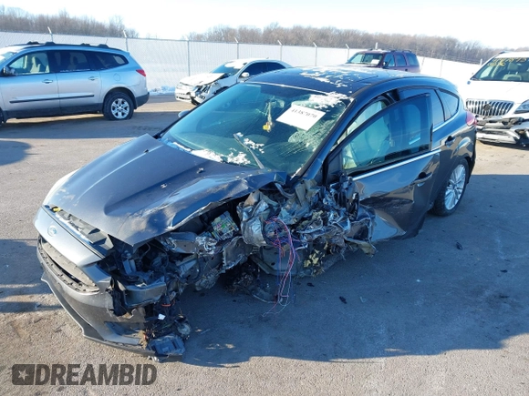 2015 Ford Focus Titanium z VIN 1FADP3N23FL368324, wystawiony jako IAAI lot #41387070 z przebiegiem Nie podano mil oraz . Historia ofert i sprzedaży dostępna na DreamBid. Obrazek 2.