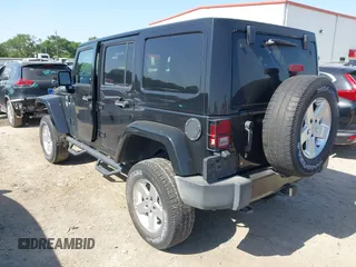 2015 Jeep Wrangler Unlimited Sahara with VIN 1C4BJWEG0FL717536, listed as a IAAI auction lot 42004096 with 90,802 mi miles and . Bid and sale history available at DreamBid. Image 3.