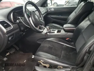 2018 Jeep Grand Cherokee Laredo E with VIN 1C4RJFAG4JC138319, listed as a Copart auction lot 54956925 with 144,938 mi miles and Salvage title. Bid and sale history available at DreamBid. Image 7.