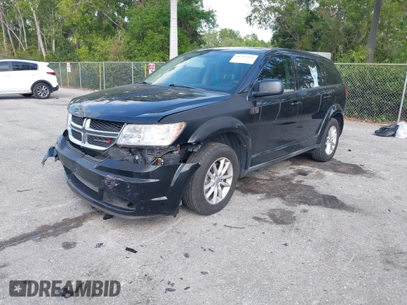 2013 Dodge Journey SE with VIN 3C4PDCAB0DT710609, listed as a IAAI auction lot 41763431 with 145,851 mi miles and . Bid and sale history available at DreamBid. Image 2.