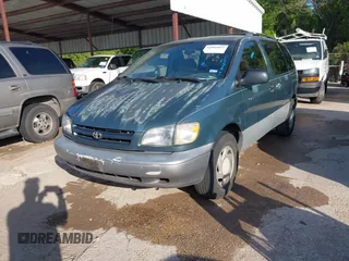 2000 Toyota Sienna LE with VIN 4T3ZF13C5YU217679, listed as a IAAI auction lot 42005053 with 198,953 mi miles. Bid and sale history available at carsss.com. Image 2.