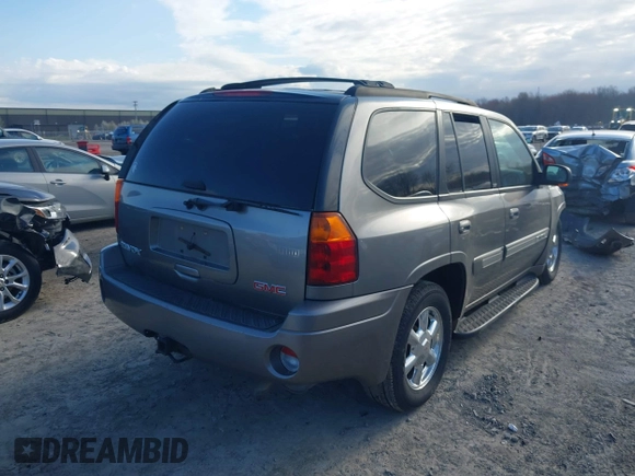 2005 GMC Envoy SLE with VIN 1GKDT13S852362380, listed as a IAAI auction lot 42031727 with 76,711 mi miles. Bid and sale history available at carsss.com. Image 4.