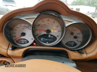 2006 Porsche Cayman S с VIN WP0AB298X6U781940, выставлен на аукционе Copart как лот 70092204 с пробегом 116 506 миль миль и Списание • Salvage title. История ставок и продаж доступна на DreamBid. Изображение 9.