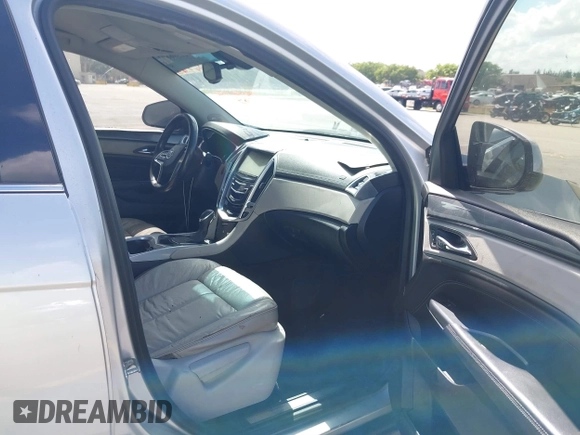 2013 Cadillac SRX z VIN 3GYFNAE32DS512534, wystawiony jako IAAI lot #41596602 z przebiegiem 193 131 mil mil oraz . Historia ofert i sprzedaży dostępna na DreamBid. Obrazek 5.