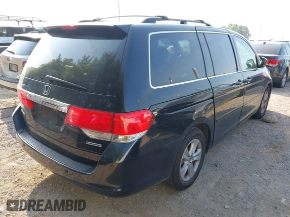 2010 Honda Odyssey Touring with VIN 5FNRL3H96AB031016, listed as a IAAI auction lot 42828397 with 261,881 mi miles and . Bid and sale history available at DreamBid. Image 4.