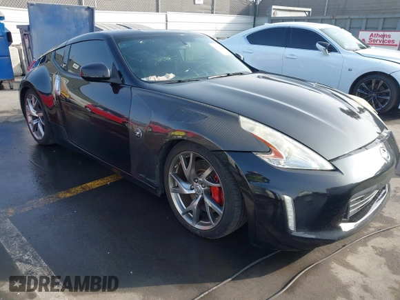 2014 Nissan 370Z Touring with VIN JN1AZ4EH1EM631097, listed as a IAAI auction lot 41230197 with 85,304 mi miles. Bid and sale history available at carsss.com. Image 1.