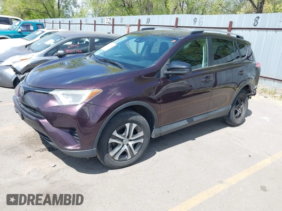 2017 Toyota RAV4 LE with VIN 2T3BFREV4HW580568, listed as a IAAI auction lot 42100704 with 157,300 mi miles and . Bid and sale history available at DreamBid. Image 2.