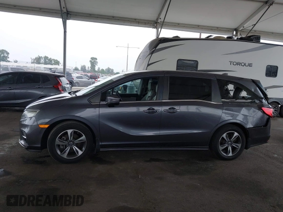 2019 Honda Odyssey Touring z VIN 5FNRL6H88KB037149, wystawiony jako IAAI lot #42356871 z przebiegiem 64 549 mil mil oraz . Historia ofert i sprzedaży dostępna na DreamBid. Obrazek 14.
