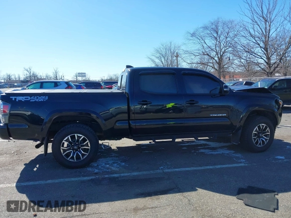 2021 Toyota Tacoma 4WD SR5 with VIN 3TMDZ5BN4MM117564, listed as a IAAI auction lot 41629220 with 77,063 mi miles. Bid and sale history available at carsss.com. Image 14.