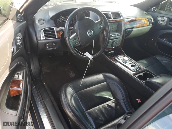 2010 Jaguar XK with VIN SAJWA4DC1AMB38762, listed as a Copart auction lot 73865884 with 98,030 mi miles and Salvage Title. Bid and sale history available at carsss.com. Image 8.