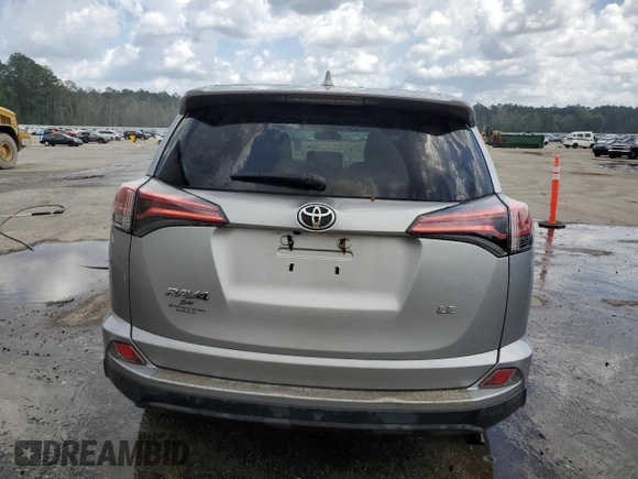 2017 Toyota RAV4 LE with VIN 2T3ZFREV3HW387441, listed as a Copart auction lot 51742245 with 104,823 mi miles and Salvage Title. Bid and sale history available at DreamBid. Image 6.