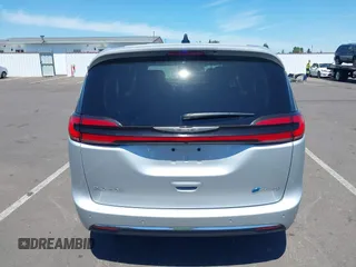 2023 Chrysler Pacifica Hybrid Touring L with VIN 2C4RC1L75PR614460, listed as a IAAI auction lot 42628545 with 68,668 mi miles and . Bid and sale history available at DreamBid. Image 16.