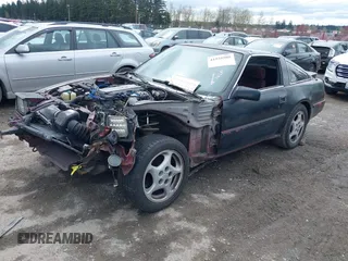 1986 Nissan 300ZX z VIN JN1HZ14S4GX140955, wystawiony jako IAAI lot #41935505 z przebiegiem 144 917 mil mil oraz . Historia ofert i sprzedaży dostępna na DreamBid. Obrazek 2.