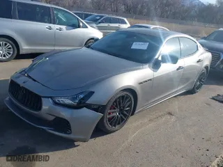 2015 Maserati Ghibli S Q4 with VIN ZAM57RTAXF1161982, listed as a IAAI auction lot 41765607 with 83,875 mi miles. Bid and sale history available at carsss.com. Image 2.