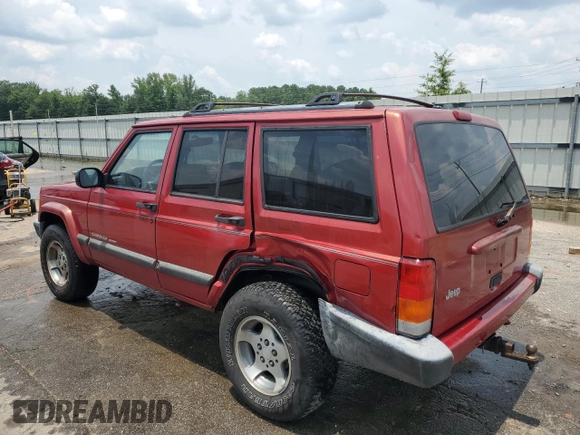 1999 Jeep Cherokee Sport with VIN 1J4FT68SXXL669549, listed as a Copart auction lot 62367015 with 194,446 mi miles and Salvage title. Bid and sale history available at DreamBid. Image 2.