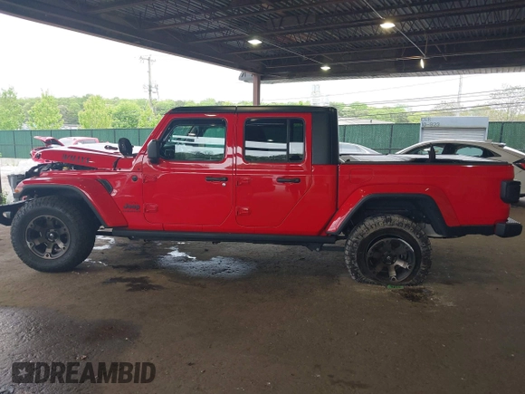 2021 Jeep Gladiator Willys with VIN 1C6HJTAG7ML602130, listed as a IAAI auction lot 42161745 with 49,576 mi miles and . Bid and sale history available at DreamBid. Image 15.