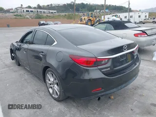 2017 Mazda Mazda6 Touring with VIN JM1GL1V51H1137065, listed as a IAAI auction lot 42078517 with 81,457 mi miles. Bid and sale history available at carsss.com. Image 3.