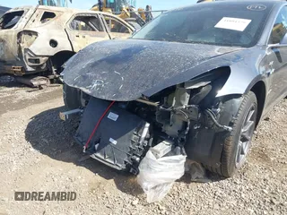 2019 Tesla Model 3 Mid Range with VIN 5YJ3E1EA5KF327679, listed as a IAAI auction lot 41804379 with 87,208 mi miles and . Bid and sale history available at DreamBid. Image 6.
