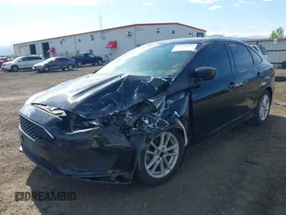2018 Ford Focus SE z VIN 1FADP3F20JL288437, wystawiony jako IAAI lot #42278885 z przebiegiem 132 504 mil mil oraz . Historia ofert i sprzedaży dostępna na DreamBid. Obrazek 2.