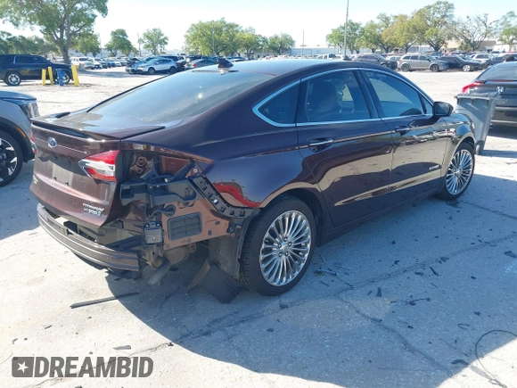 2019 Ford Fusion Hybrid Titanium with VIN 3FA6P0RU2KR123786, listed as a IAAI auction lot 41857026 with 49,604 mi miles. Bid and sale history available at carsss.com. Image 4.