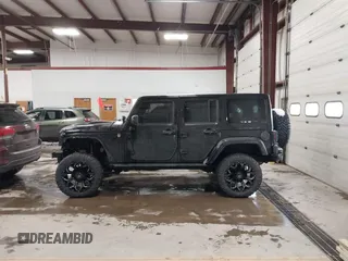 2015 Jeep Wrangler Unlimited Sahara with VIN 1C4BJWEG6FL688382, listed as a IAAI auction lot 41620621 with 138,119 mi miles. Bid and sale history available at carsss.com. Image 15.